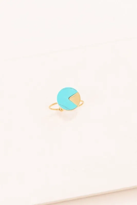 Circle, marble stone ring with a gold peak cut out
